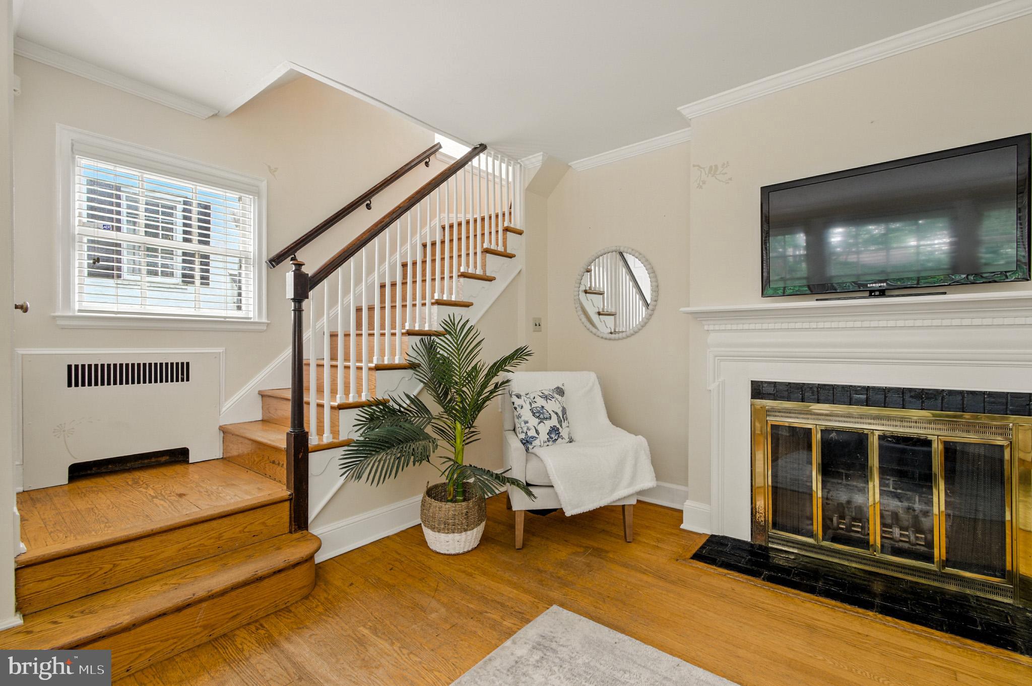 310 Paddington Road Baltimore, MD 21212 - Photo 9 of 59 a living room with furniture and a fireplace