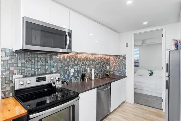 a kitchen with a stove and a microwave