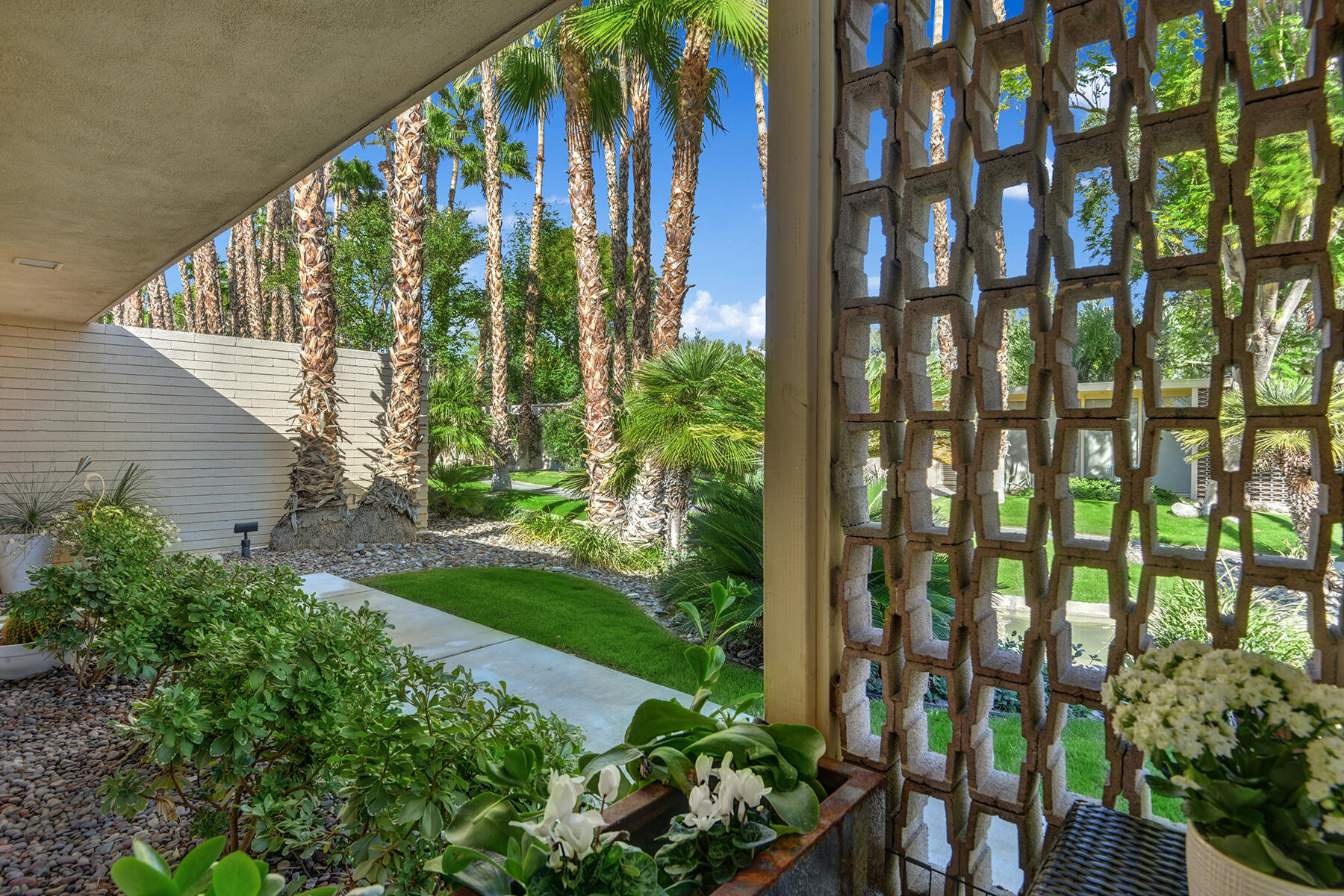 360 Cabrillo Road, Unit 202 Palm Springs, CA 92262 - Photo 13 of 49 BACK DINING PATIO PEEK A BOO OUT MLS