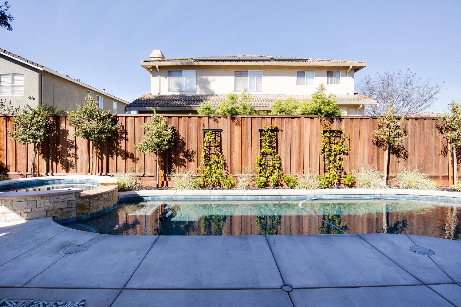 637 Rebekah Court Ripon, CA 95366 - Photo 58 of 69 a view of a patio with table and chairs potted plants