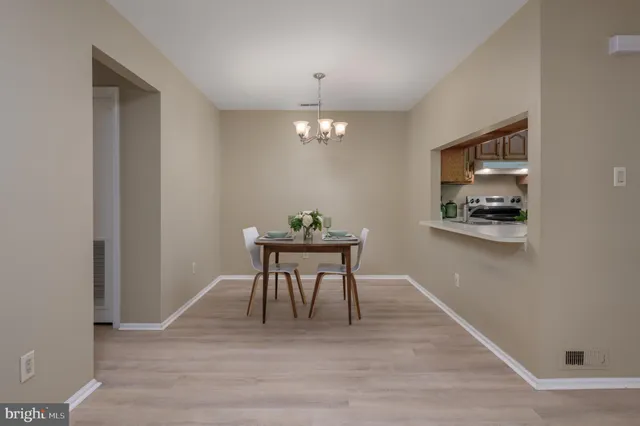 a workspace with furniture and chandelier