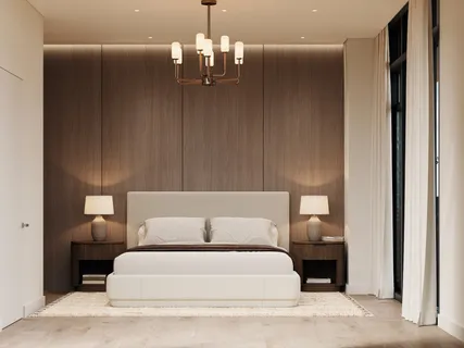 a spacious bedroom with a large bed and a chandelier