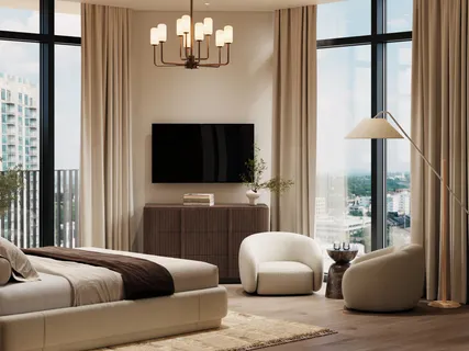 a bedroom with furniture and a flat screen tv