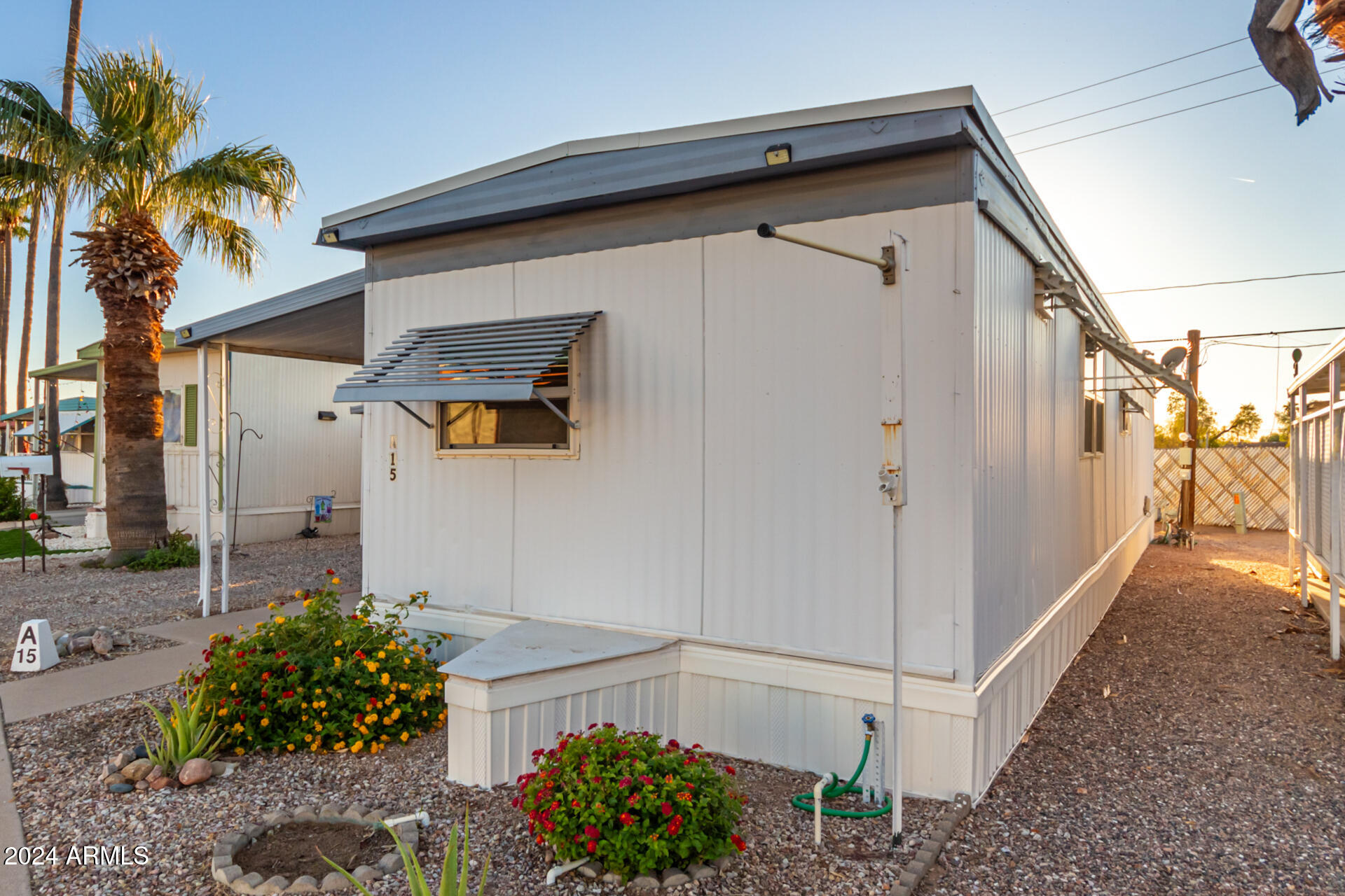 44 South Hawes Road, Unit A15 Mesa, AZ 85208 - Photo 2 of 40 a view of a house with a small yard