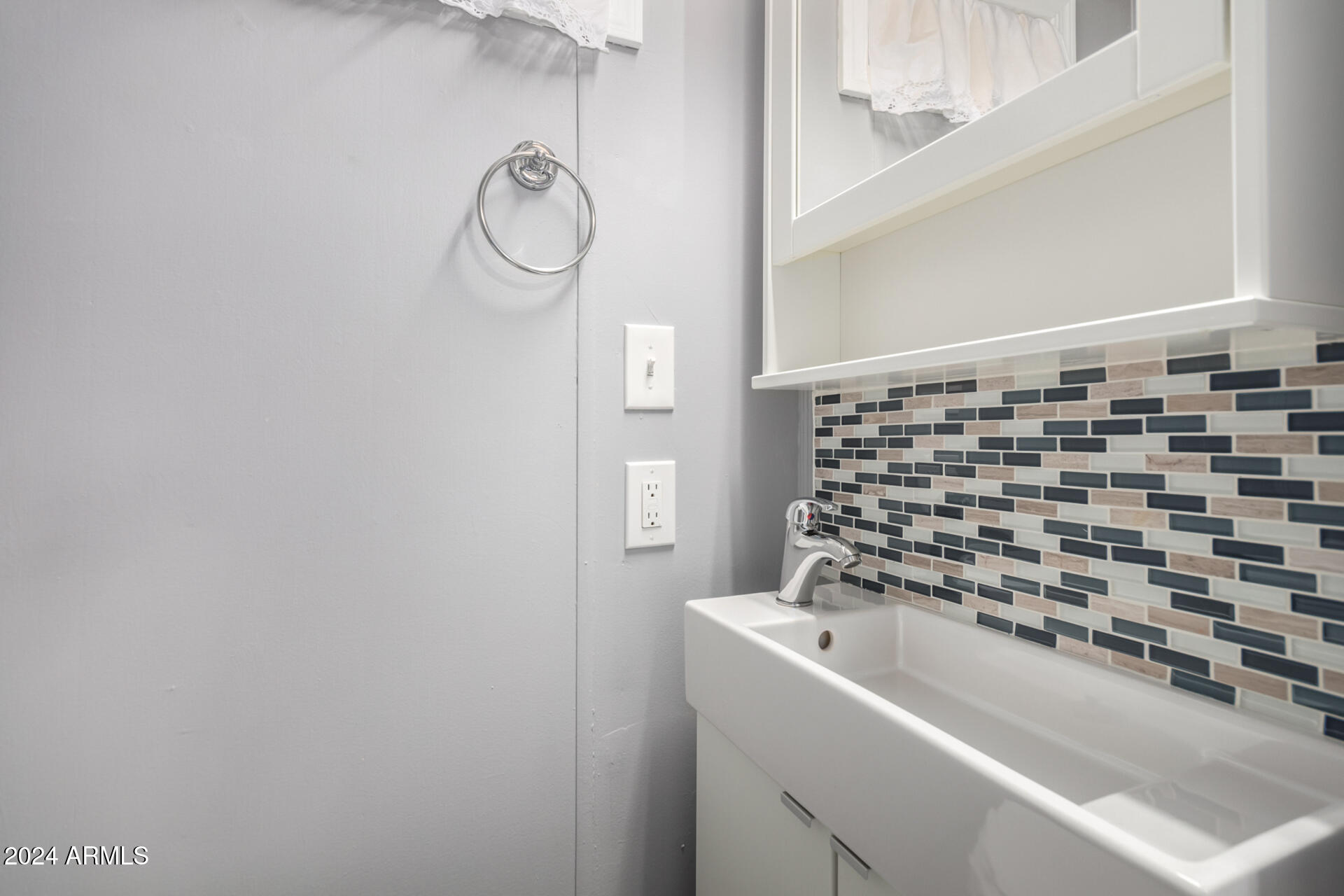 44 South Hawes Road, Unit A15 Mesa, AZ 85208 - Photo 22 of 40 a bathroom with a sink a toilet and shower