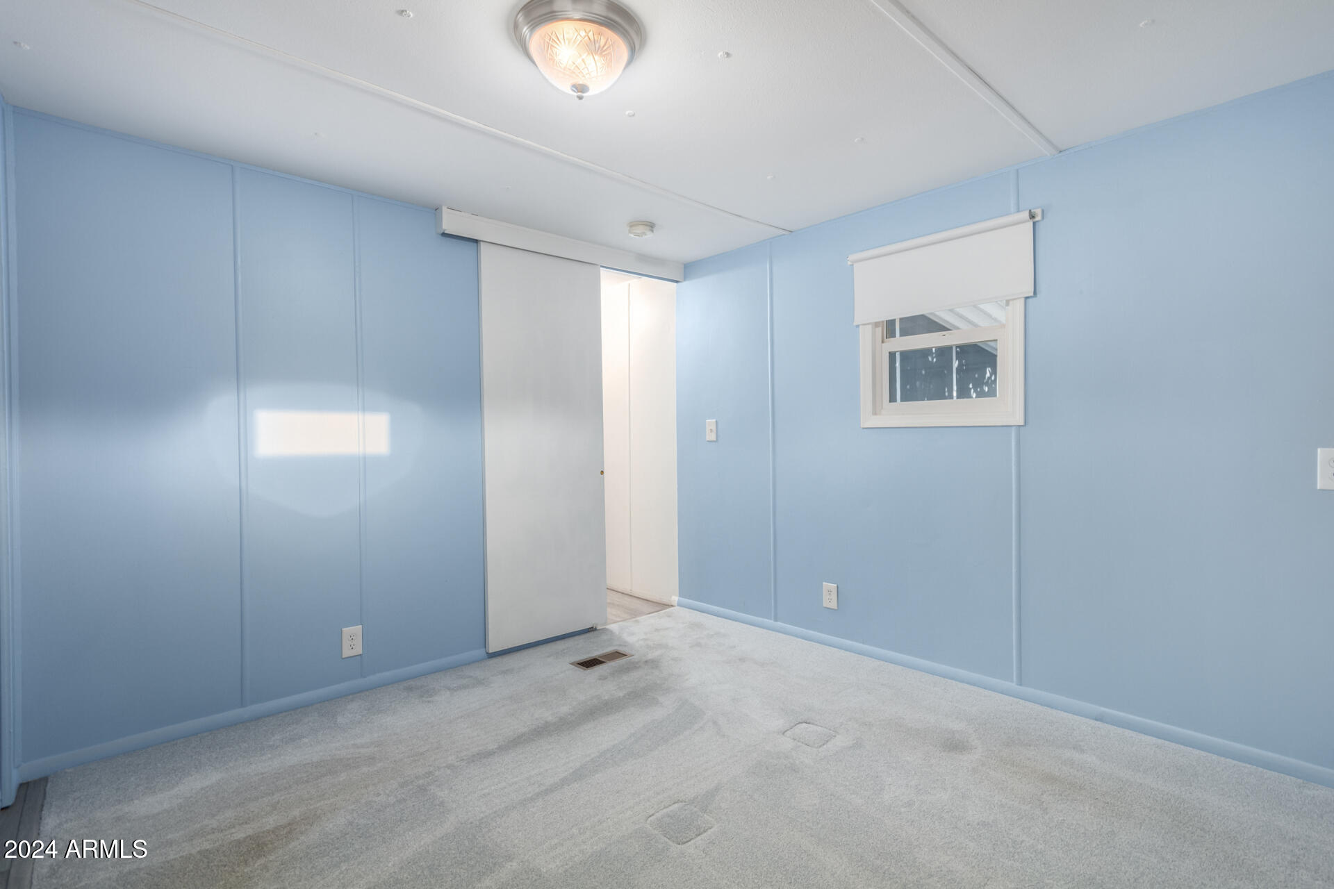 44 South Hawes Road, Unit A15 Mesa, AZ 85208 - Photo 26 of 40 a view of an empty room with a window