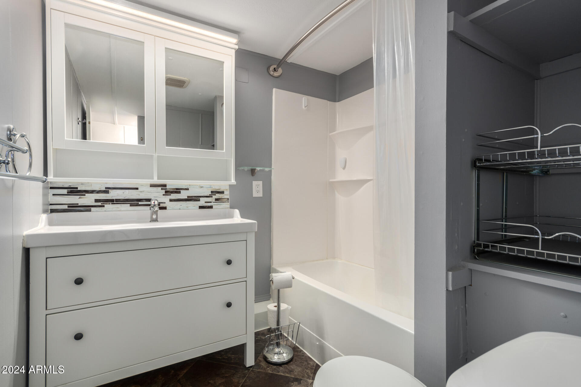 44 South Hawes Road, Unit A15 Mesa, AZ 85208 - Photo 27 of 40 a bathroom with a sink a toilet a mirror and shower