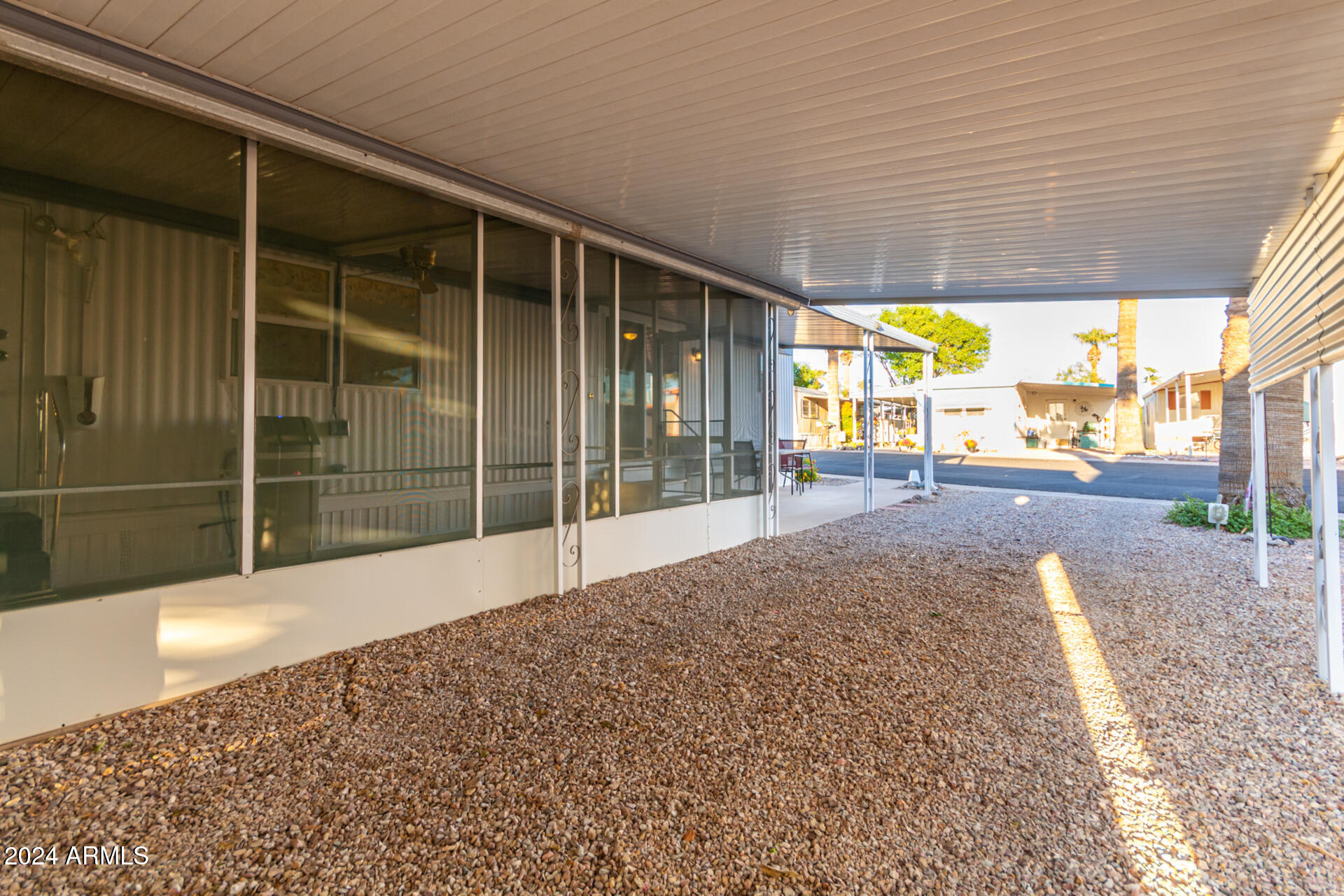 44 South Hawes Road, Unit A15 Mesa, AZ 85208 - Photo 30 of 40 a view of an empty room with a sliding door