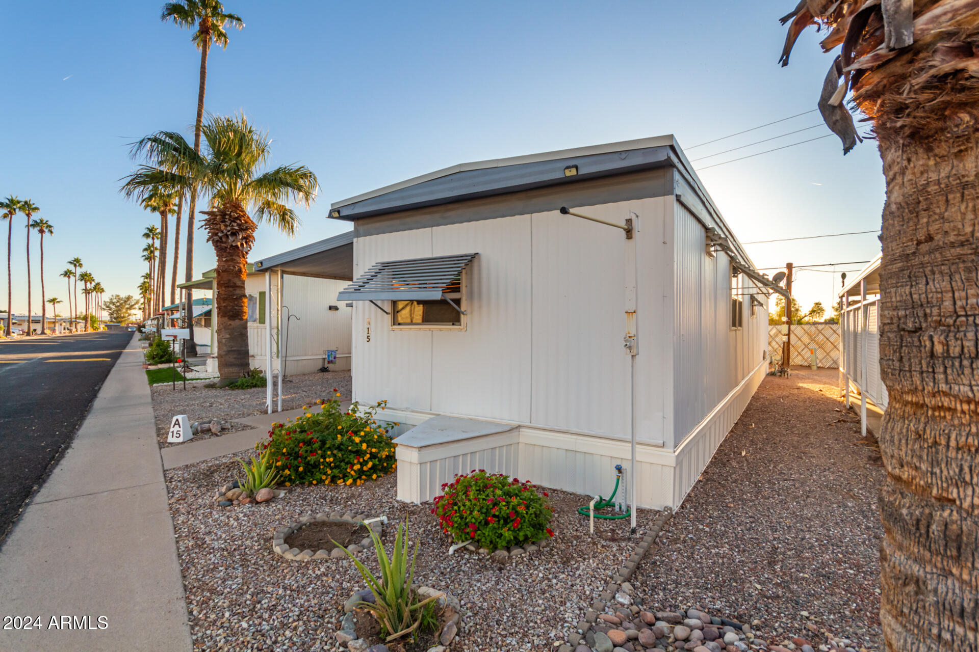 44 South Hawes Road, Unit A15 Mesa, AZ 85208 - Photo 3 of 40 a view of a house with a backyard