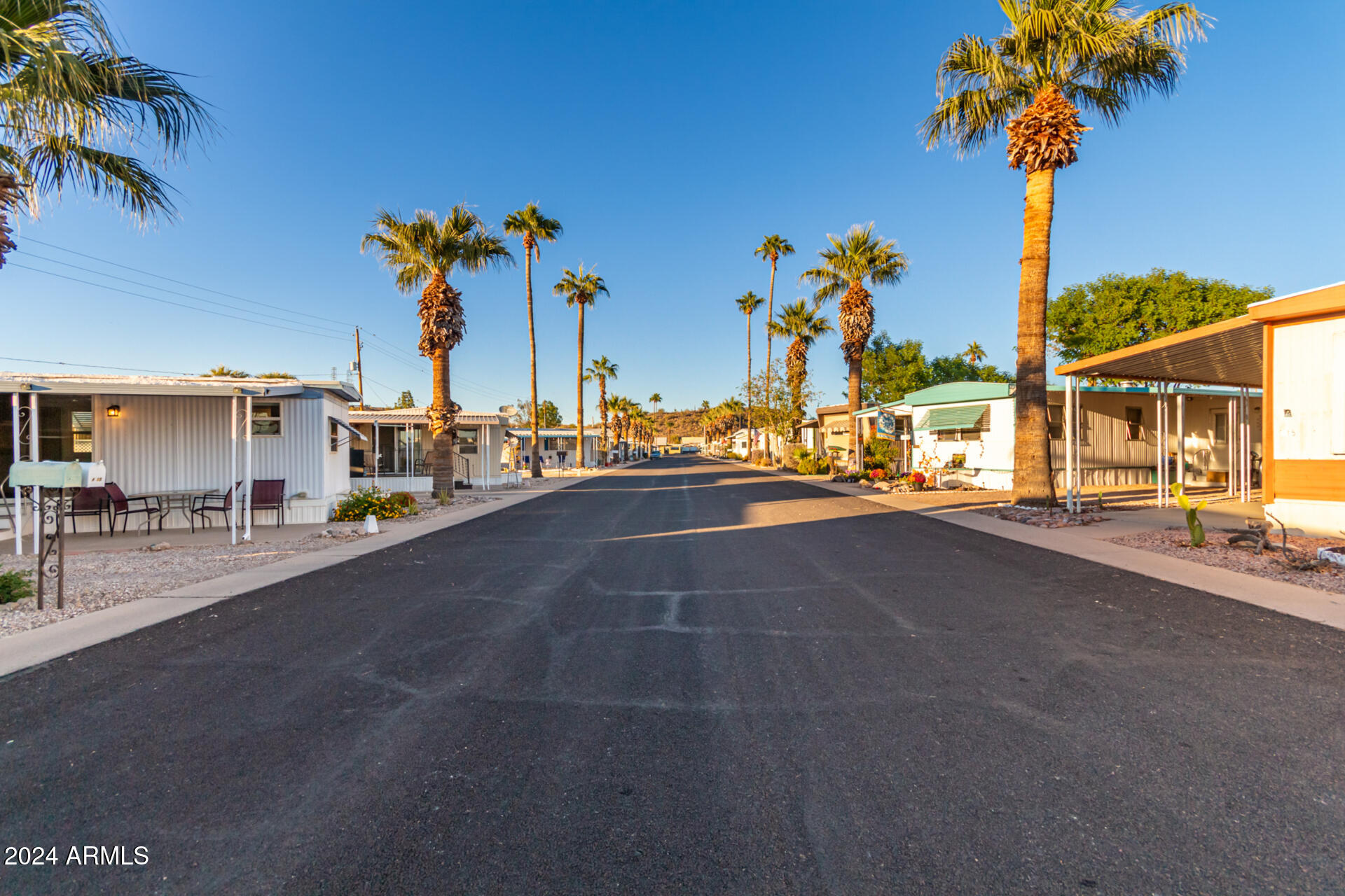 44 South Hawes Road, Unit A15 Mesa, AZ 85208 - Photo 31 of 40 a view of a street with palm trees