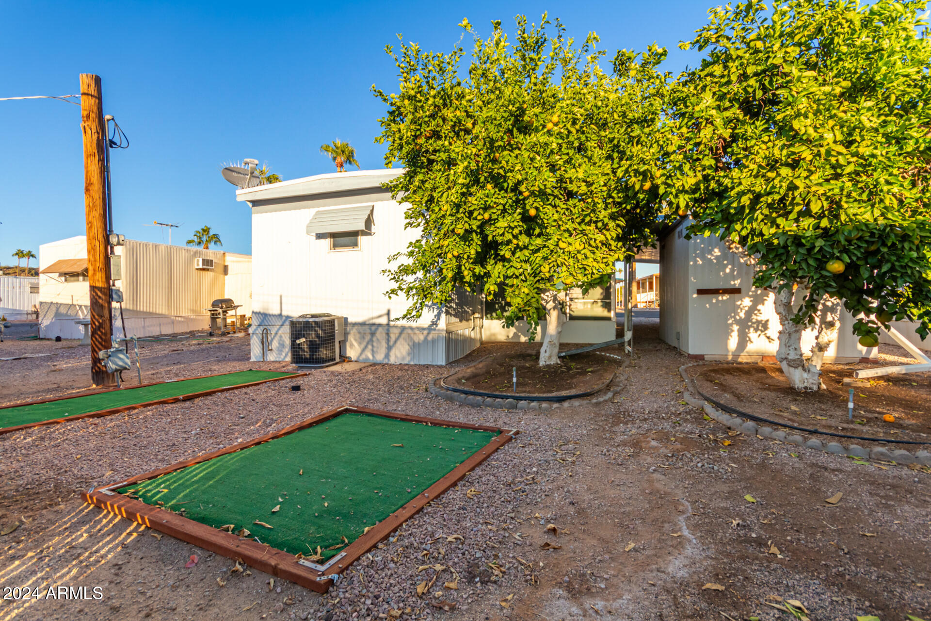 44 South Hawes Road, Unit A15 Mesa, AZ 85208 - Photo 36 of 40 a view of a house with backyard and a tree