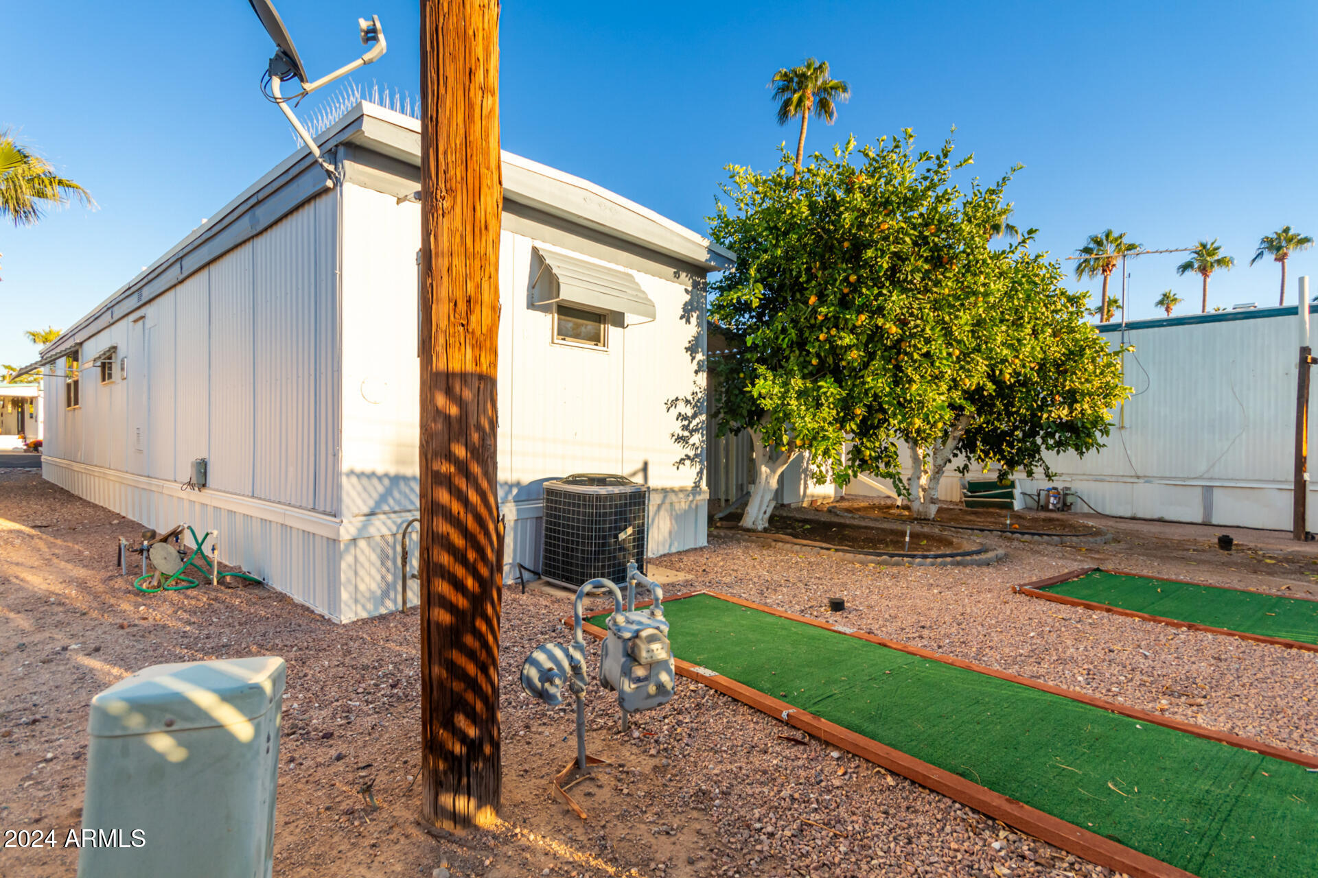 44 South Hawes Road, Unit A15 Mesa, AZ 85208 - Photo 38 of 40 a backyard of a house with seating space