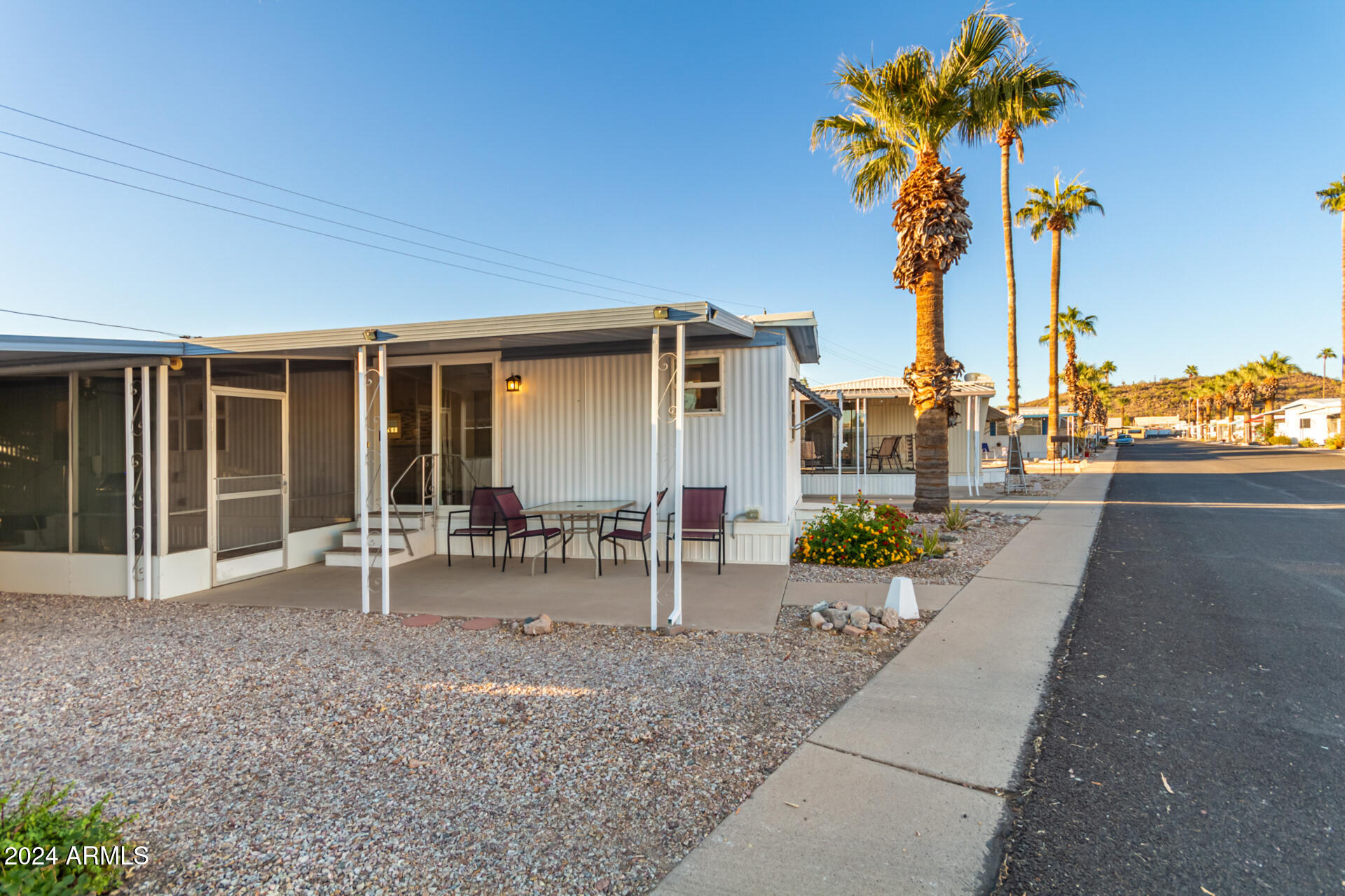 44 South Hawes Road, Unit A15 Mesa, AZ 85208 - Photo 5 of 40 a view of a patio with table and chairs and potted plants