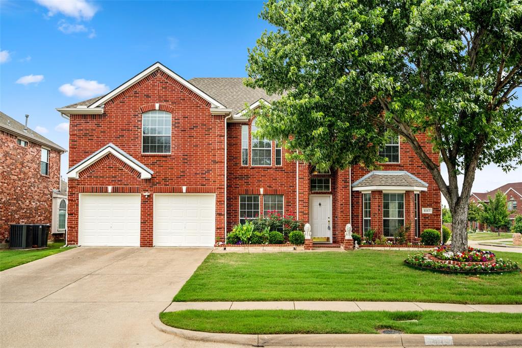1117 Ruby Street Plano, TX 75094 - Photo 1 of 1 a front view of a house with a yard