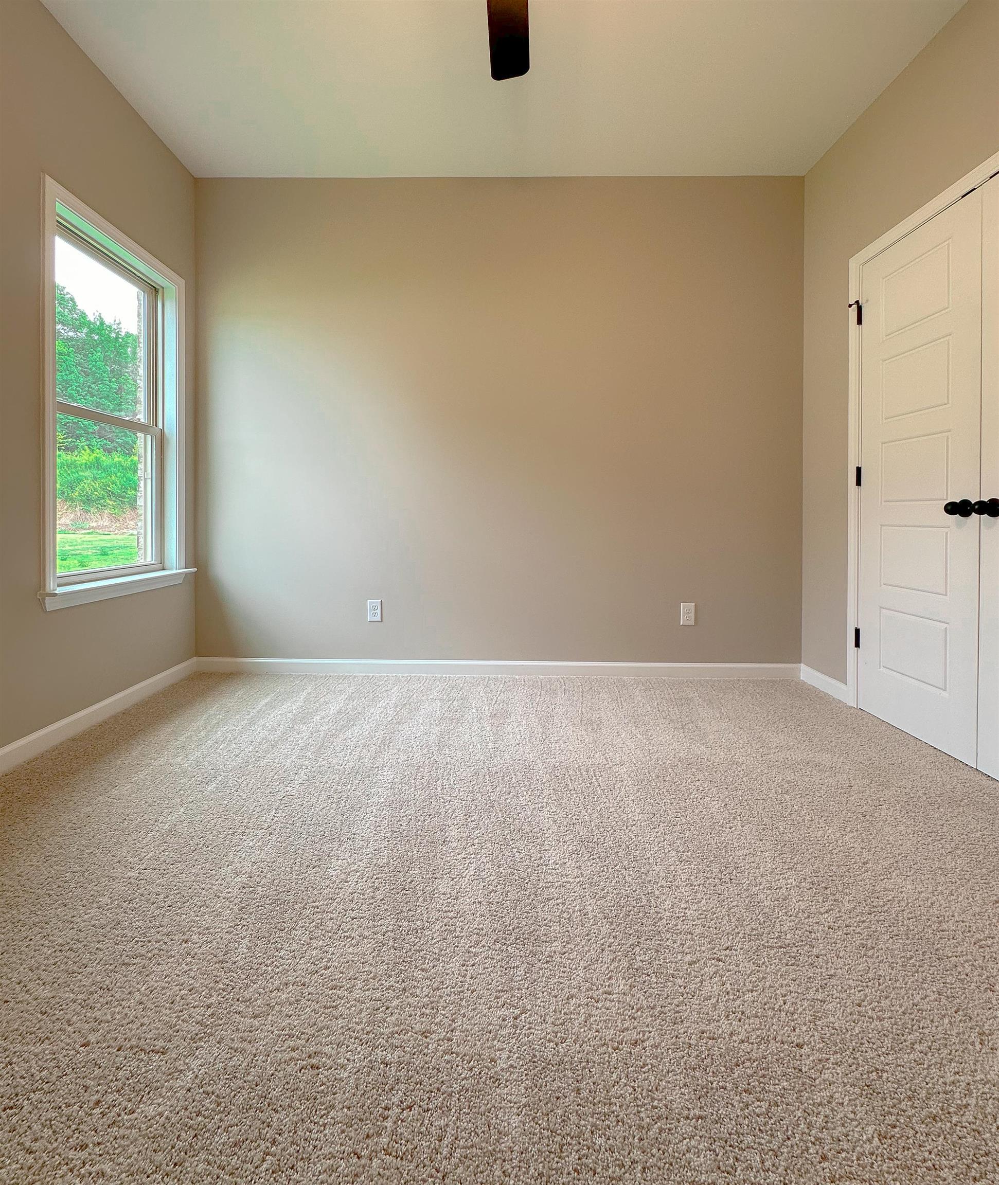 126 Stewart Road Munford, TN 38058 - Photo 18 of 23 Spare room featuring ceiling fan and carpet floors