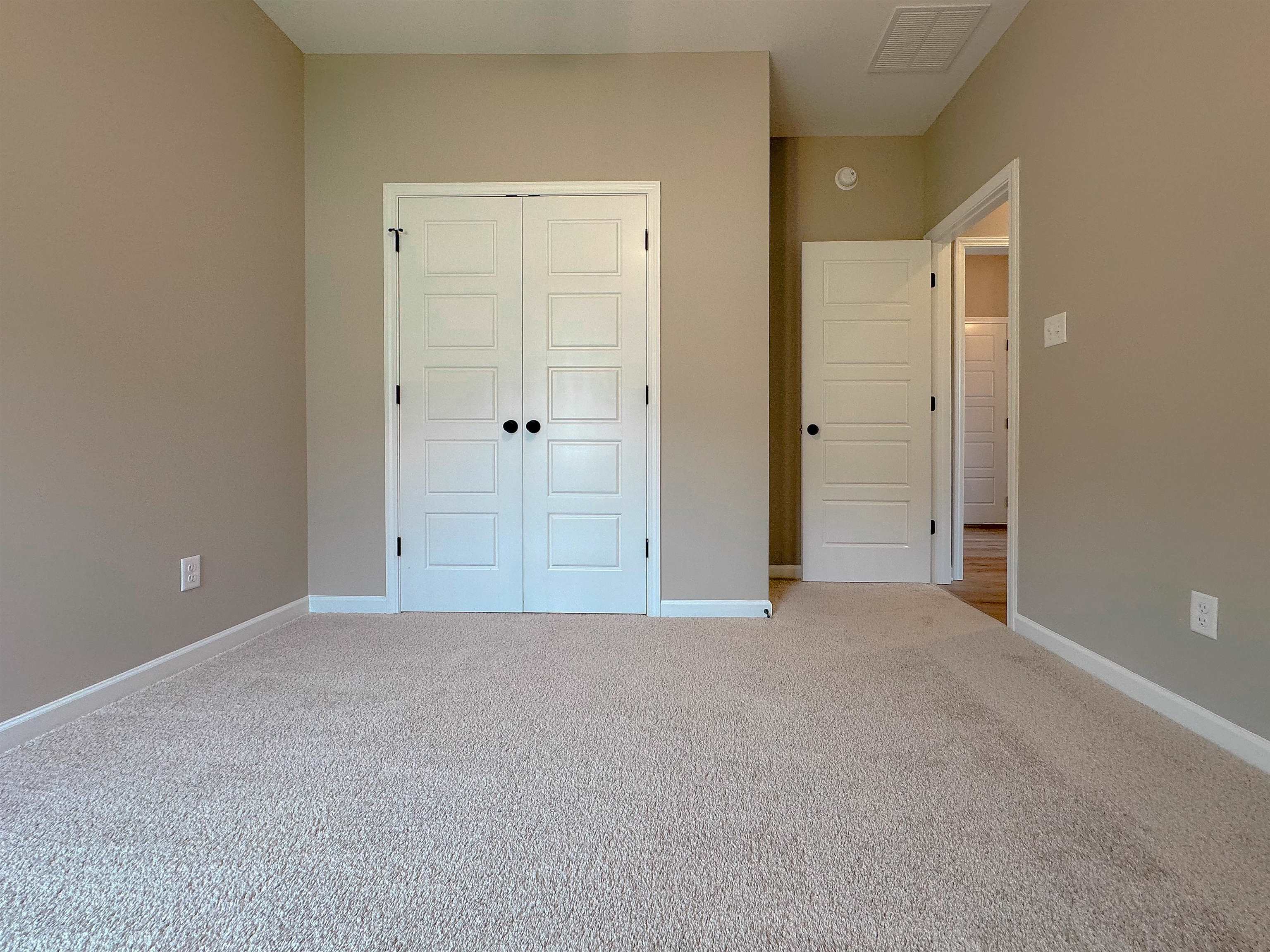 126 Stewart Road Munford, TN 38058 - Photo 21 of 23 Unfurnished bedroom featuring carpet and a closet