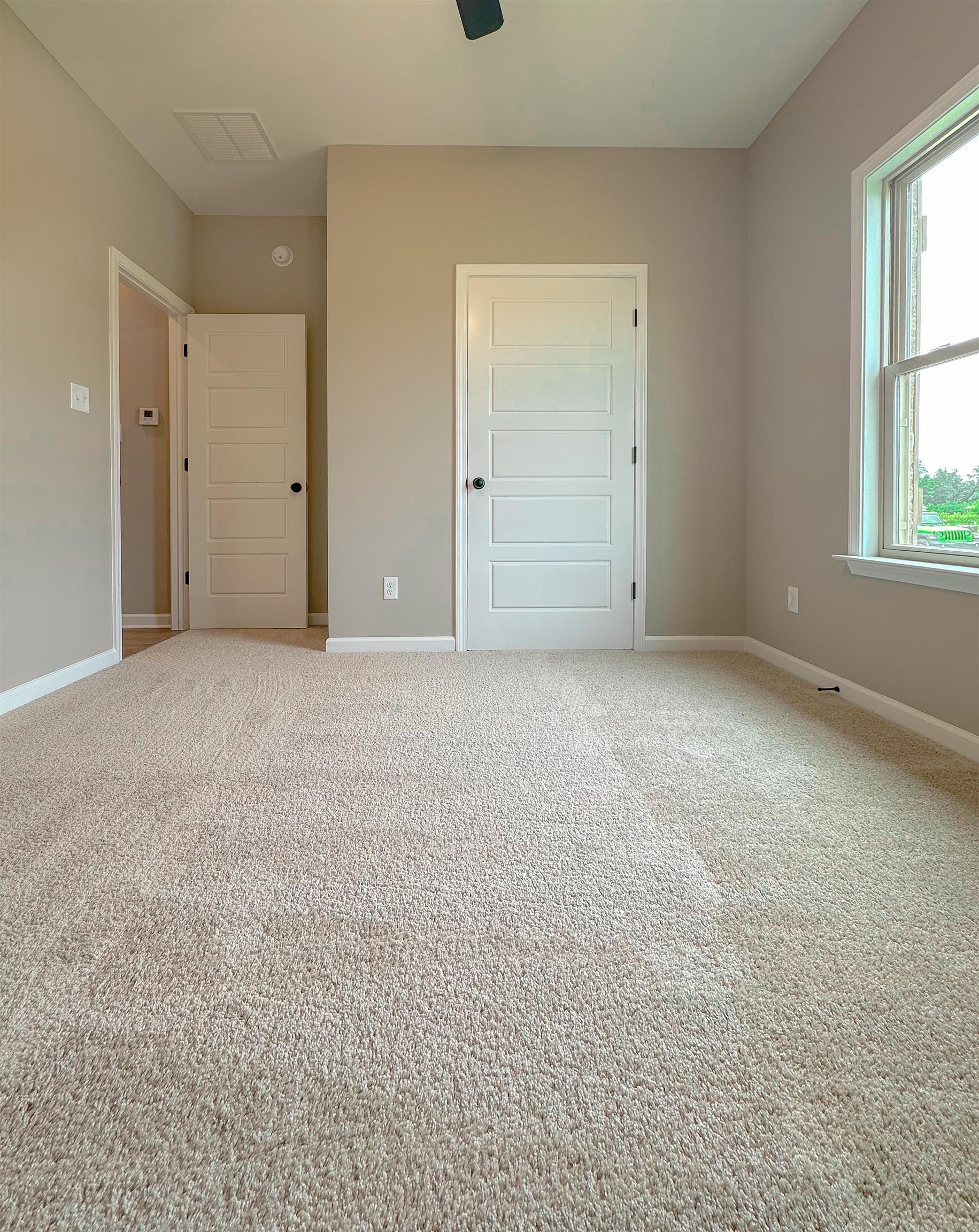 126 Stewart Road Munford, TN 38058 - Photo 22 of 23 Unfurnished bedroom with carpet flooring and ceiling fan