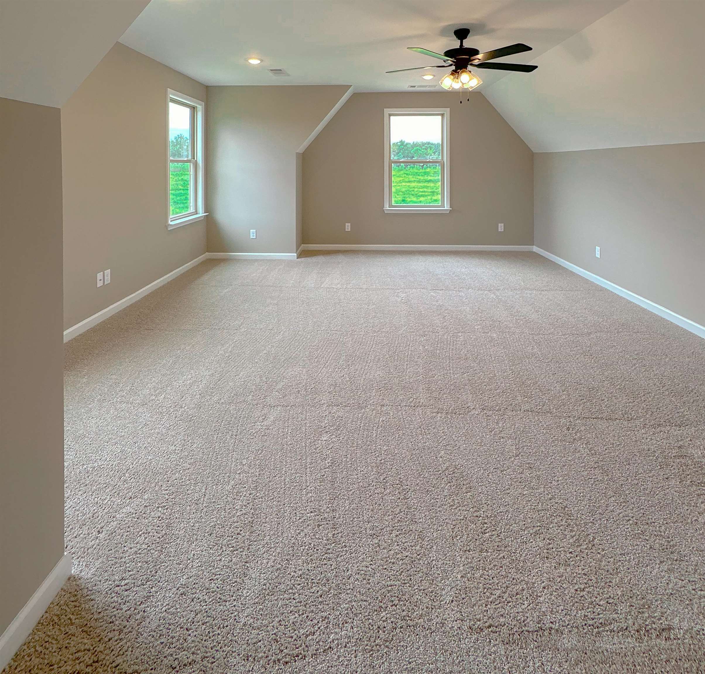 126 Stewart Road Munford, TN 38058 - Photo 23 of 23 Additional living space with lofted ceiling, light colored carpet, and ceiling fan