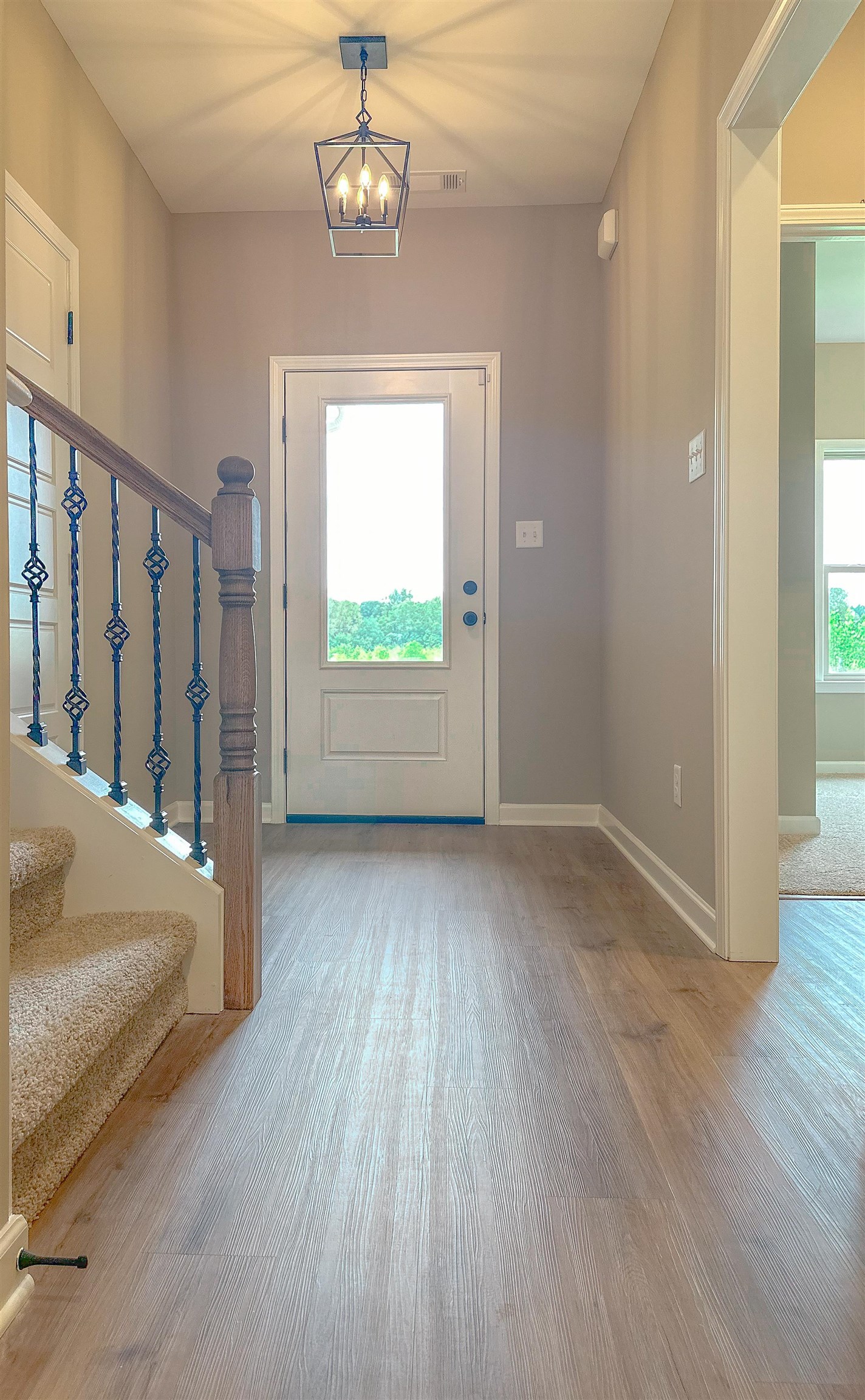 126 Stewart Road Munford, TN 38058 - Photo 3 of 23 Entrance foyer with a notable chandelier and hardwood / wood-style floors