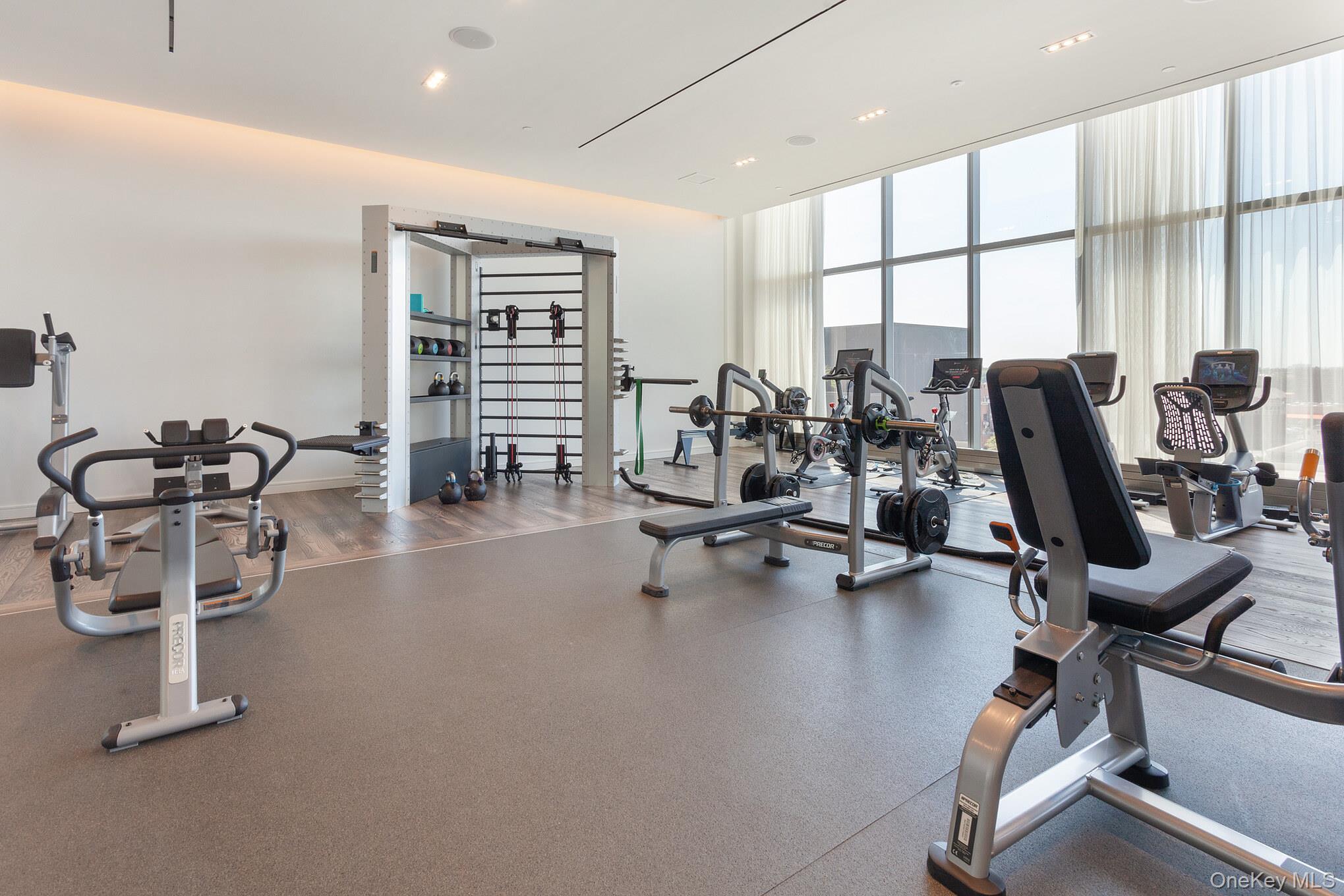 131-03 40 Road, Unit 11J Queens, NY 11354 - Photo 13 of 24 a view of a room with gym equipment