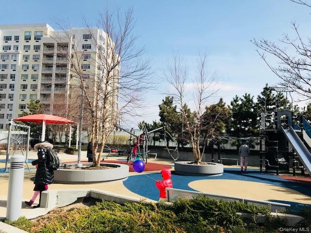 131-03 40 Road, Unit 11J Queens, NY 11354 - Photo 18 of 24 a view of swimming pool with outdoor seating