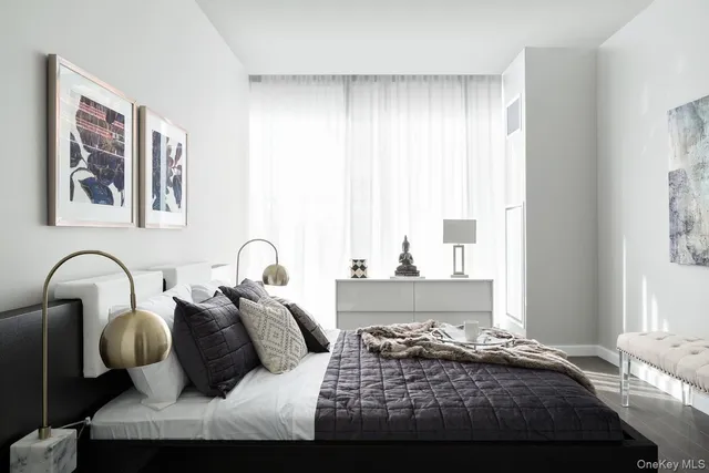 a bedroom with bed and window