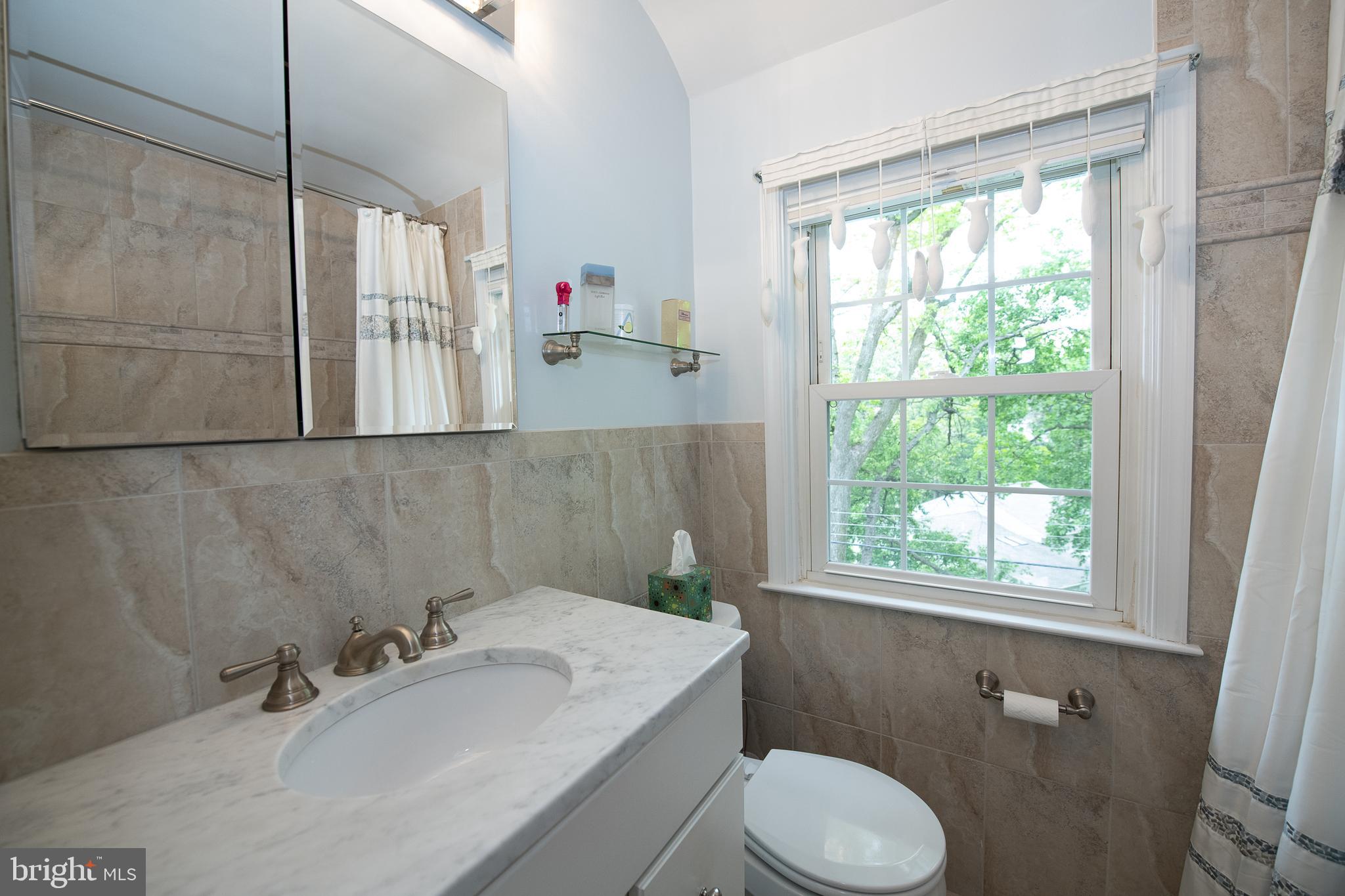 116 Snyder Lane Springfield, PA 19064 - Photo 21 of 32 Hall Bathroom with marble sink