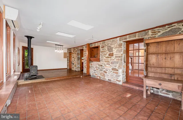 a view of an empty room with windows