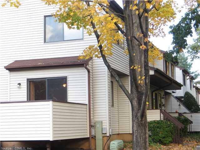 731 Cypress Road, Unit 731 Newington, CT 06111 - Photo 1 of 1 a view of a house with a door and a tree