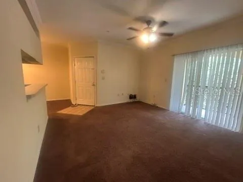 a view of a kitchen cabinets and a stove top oven
