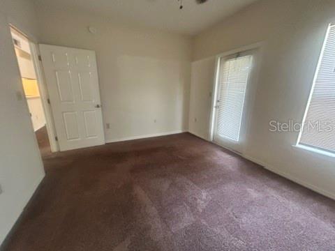 5616 Pinnacle Heights Circle, Unit 302 Tampa, FL 33624 - Photo 8 of 12 an empty room with windows and closet