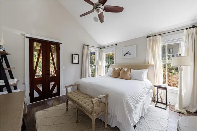 a bedroom with a large bed and a window