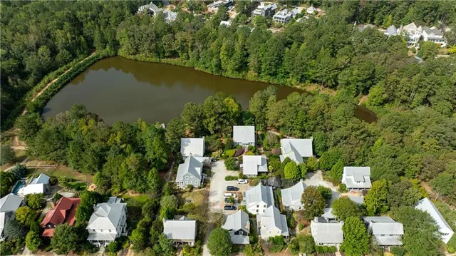 an aerial view of residential house with outdoor space and trees around