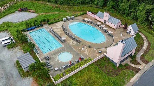an aerial view of a house a yard and outdoor seating