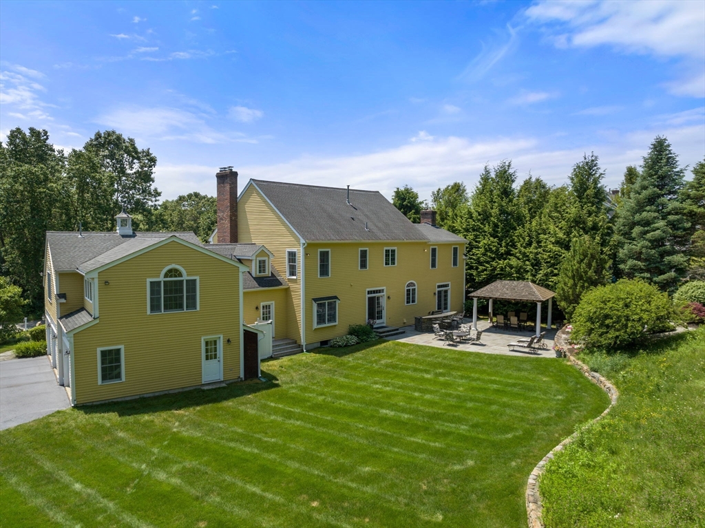 40 York Road Wayland, MA 01778 - Photo 3 of 37 a front view of a house with a yard