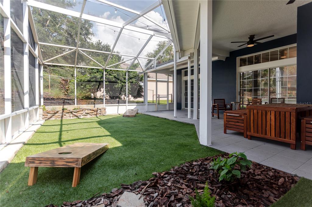 3111 Indian Trail Eustis, FL 32726 - Photo 16 of 29 a backyard of a house with garden and outdoor seating