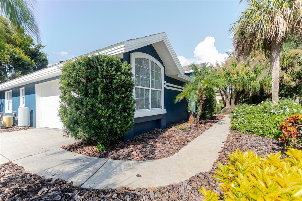 3111 Indian Trail Eustis, FL 32726 - Photo 17 of 29 a front view of a house with garden
