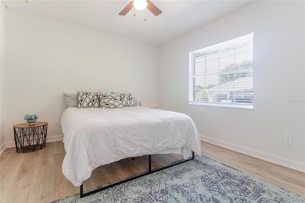 3111 Indian Trail Eustis, FL 32726 - Photo 21 of 29 a bedroom with a bed and a window