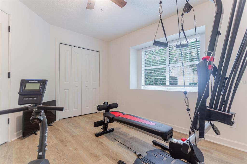 3111 Indian Trail Eustis, FL 32726 - Photo 24 of 29 a room with gym equipment and a window