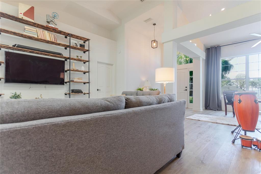 3111 Indian Trail Eustis, FL 32726 - Photo 6 of 29 a living room with furniture and a flat screen tv