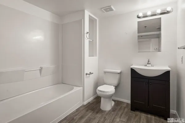 a bathroom with a sink toilet a bathtub and shower