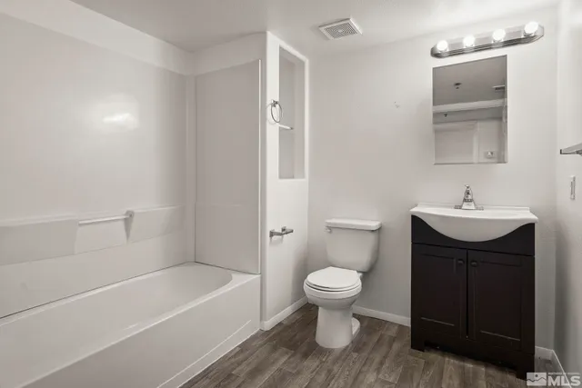 a bathroom with a sink toilet a bathtub and shower