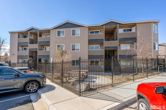 a front view of a house with parking space