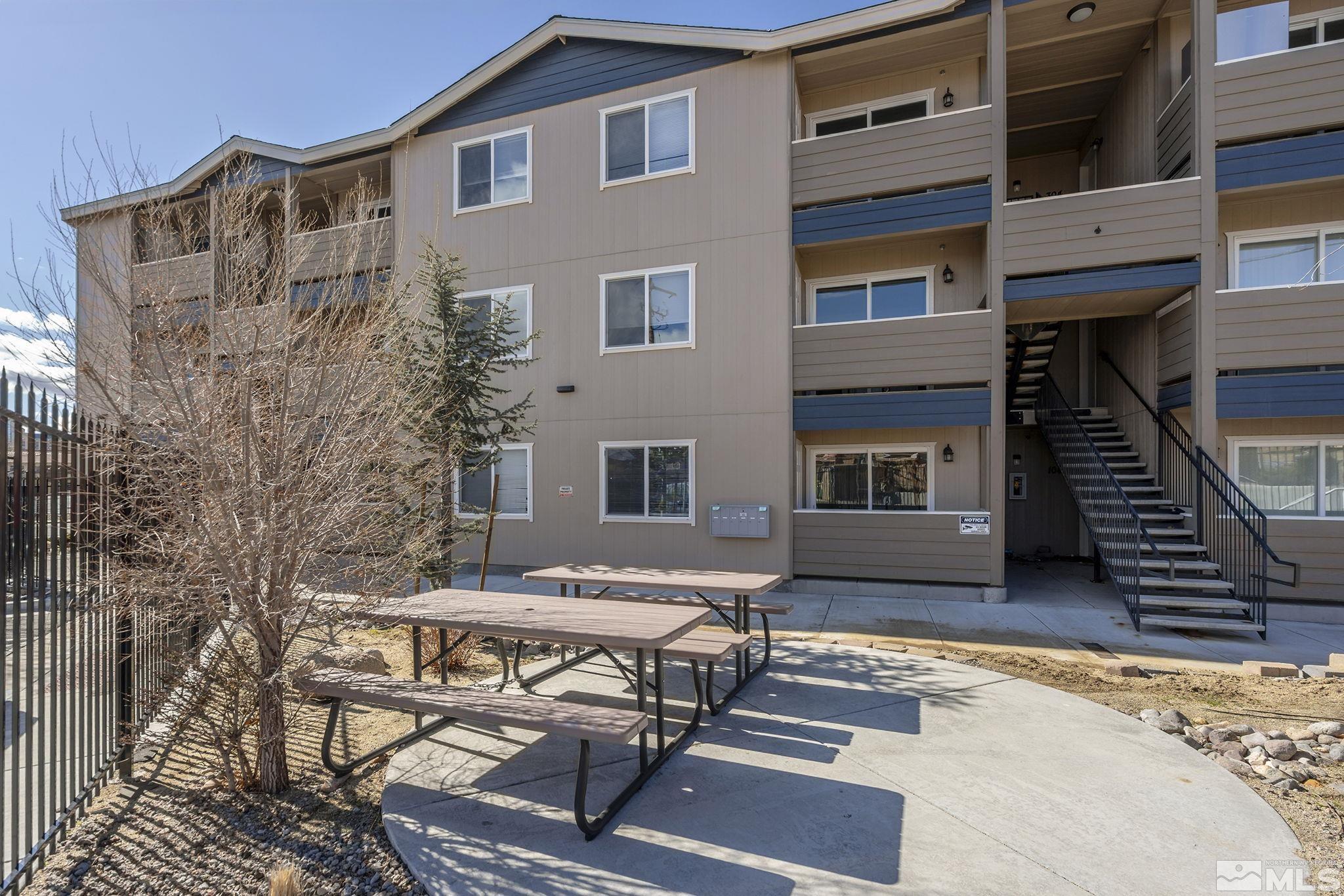 15 Gentry Way, Unit 12 Reno, NV 89502 - Photo 5 of 19 a view of a house with backyard and sitting area