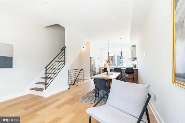 a view of a dining room with furniture window and entryway