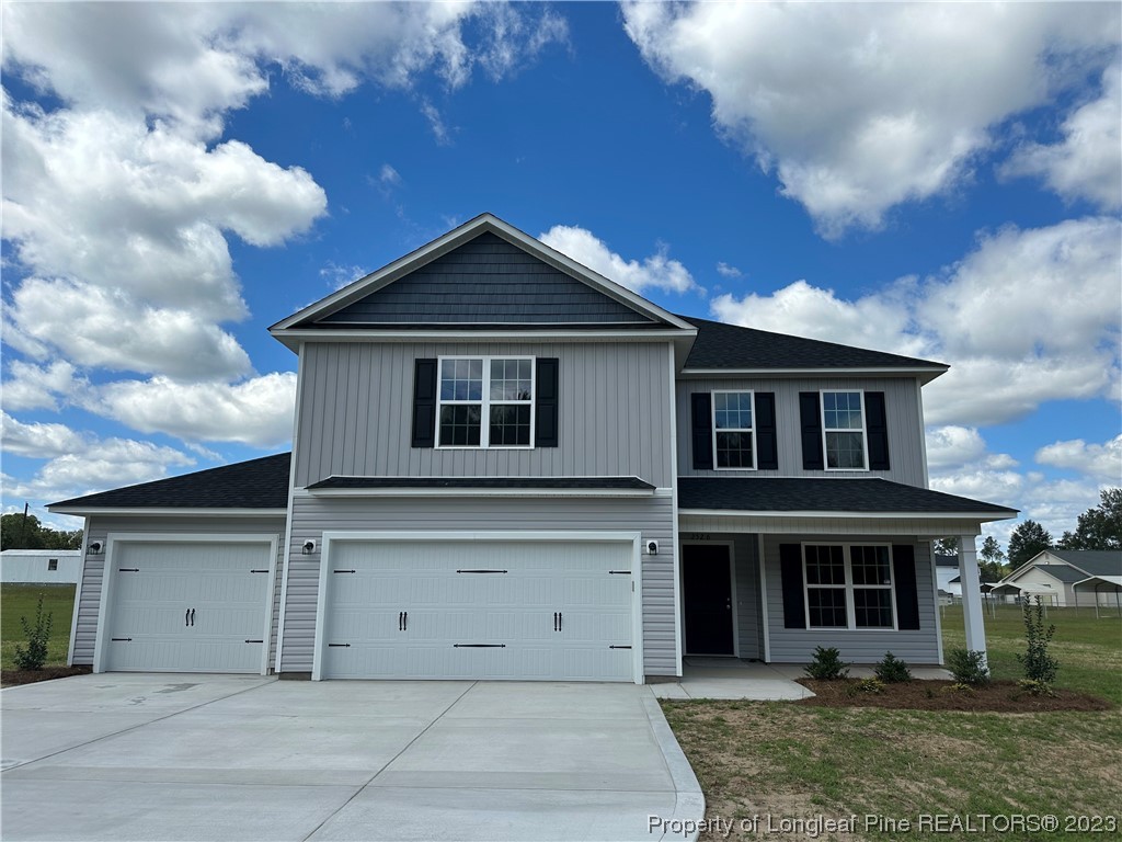 2526 Sand Hill Road Fayetteville, NC 28306 - Photo 1 of 40 a view of a house with a garden