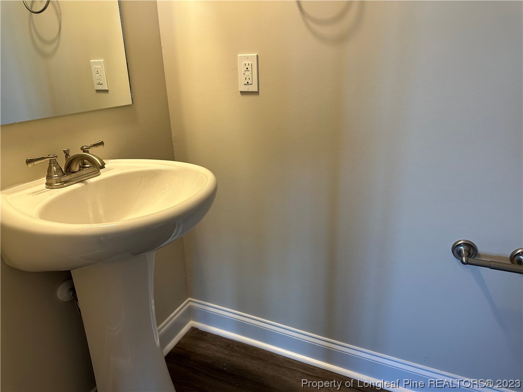 2526 Sand Hill Road Fayetteville, NC 28306 - Photo 13 of 40 a bathroom with a sink and mirror