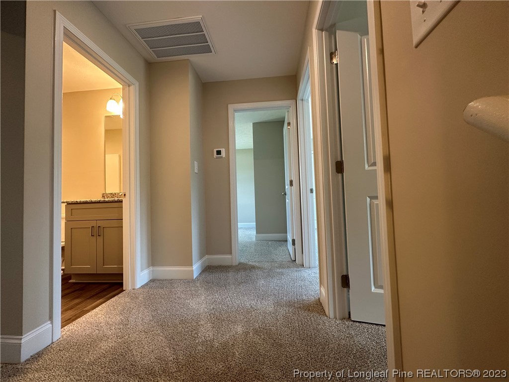 2526 Sand Hill Road Fayetteville, NC 28306 - Photo 15 of 40 a view of a bathroom with a glass door and a window