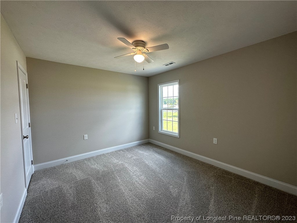 2526 Sand Hill Road Fayetteville, NC 28306 - Photo 16 of 40 a view of an empty room with a window