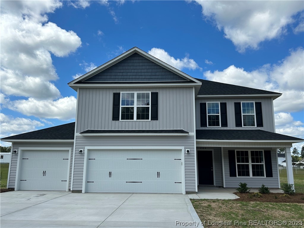 2526 Sand Hill Road Fayetteville, NC 28306 - Photo 2 of 40 a view of a house with a garage